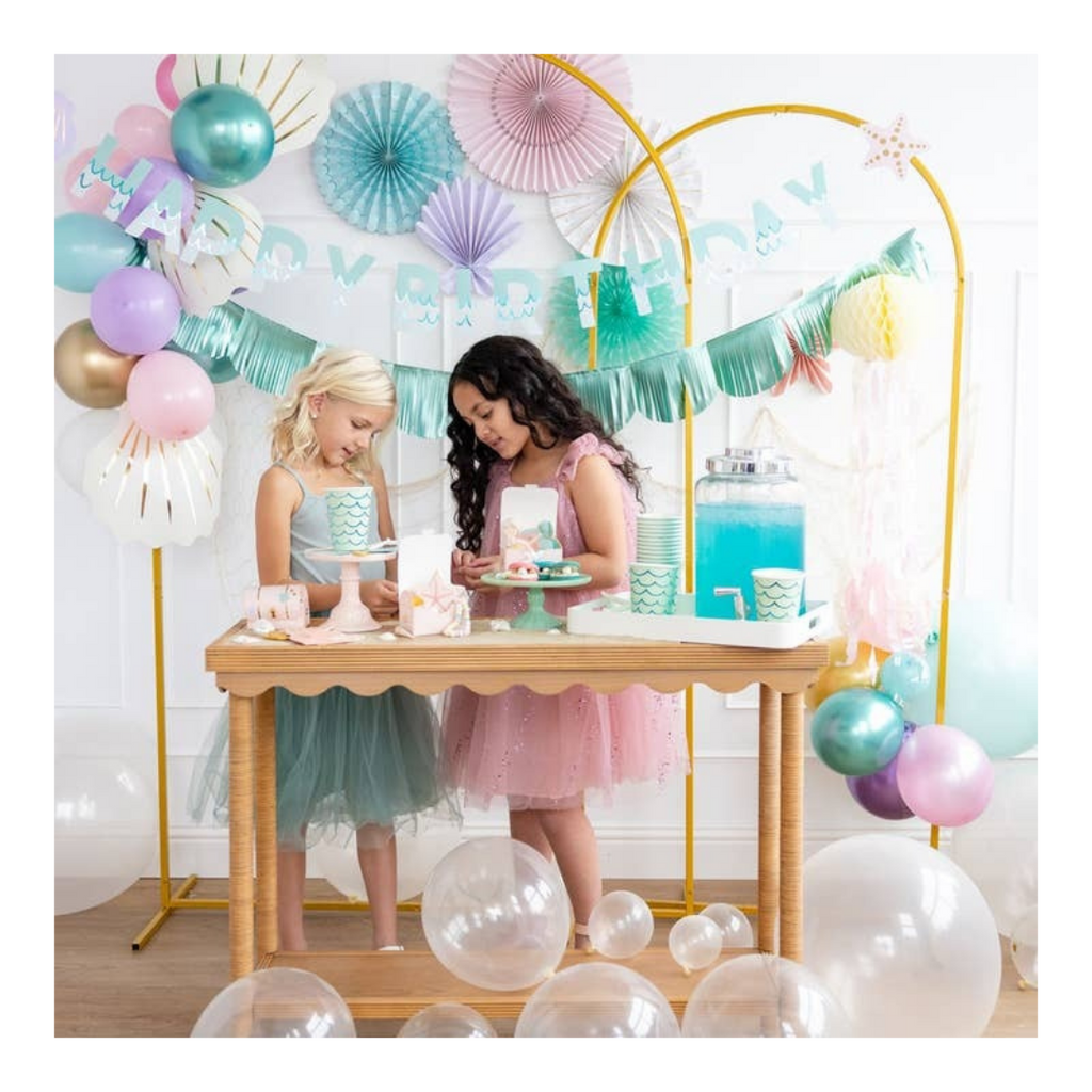 Pastel mermaid birthday decorations with balloons and cake table from Parte Haus party supply store in Bethesda Maryland