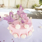 Pink princess cake decorations with castle dragon carriage and princess theme from Parte Haus party supply store in Bethesda Maryland