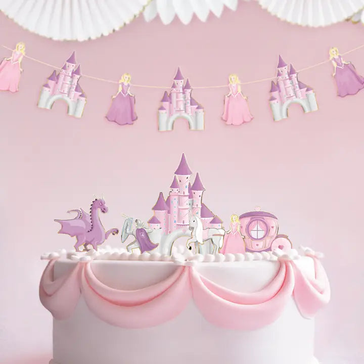 Pink princess cake decorations with castle dragon and carriage for birthday from Parte Haus party supply store in Bethesda MD