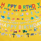 Colorful safari paper garland with animals dinosaurs trucks and Happy Birthday banner birthday from Parte Haus party supply store in Bethesda MD