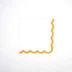 Yellow scallop cocktail napkin with wavy border for celebrations from Parte Haus party supply store in Bethesda MD