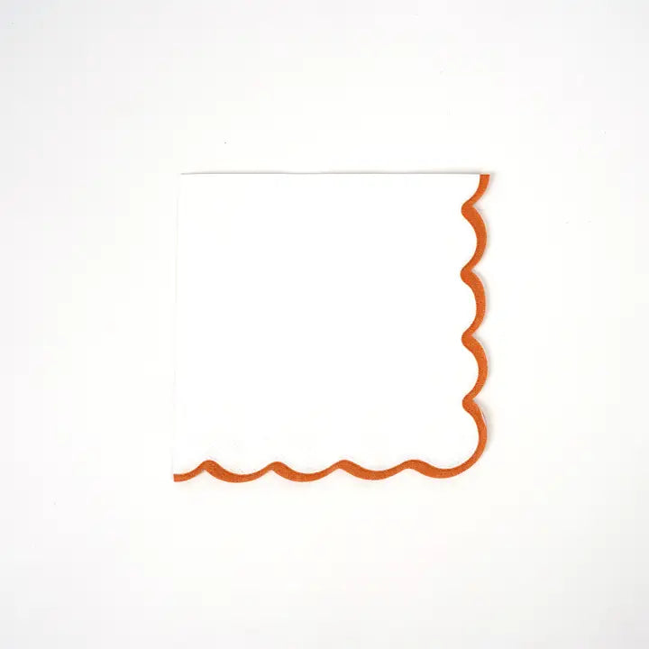 Orange white scallop cocktail napkin with wavy border for celebrations from Parte Haus party supply store in Bethesda MD