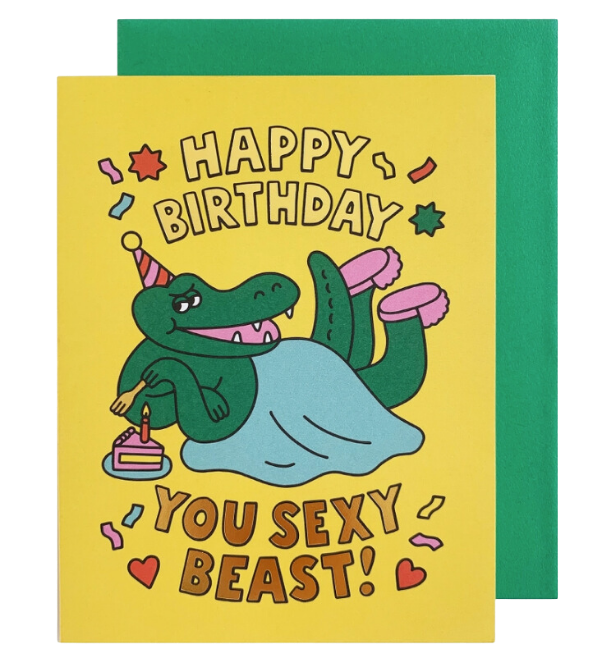 Yellow funny birthday card with cartoon alligator in slippers and confetti from Parte Haus party supply store in Bethesda MD