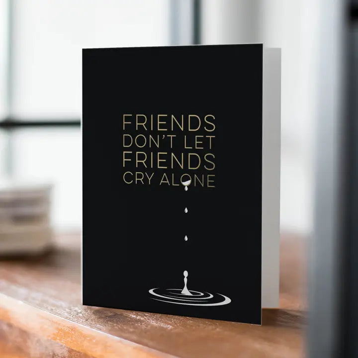 Black supportive card with gold text and water drop sympathy design for comfort from Parte Haus party supply store in Bethesda MD.