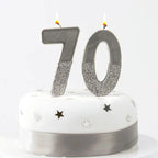 Silver glitter number candle 70 birthday decoration on cake from Parte Haus party supply store in Bethesda Maryland