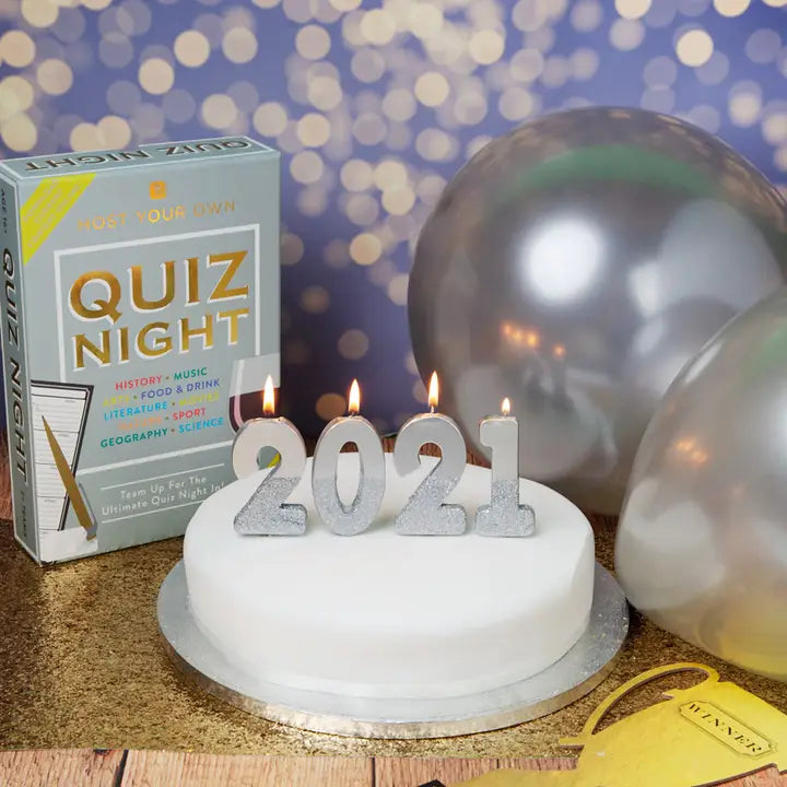 Silver glitter number candles on cake new year theme from Parte Haus party supply store in Bethesda Maryland