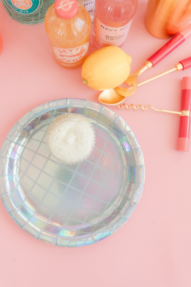 Silver holographic dinner plate with a cupcake for disco theme from Parte Haus party supply store in Bethesda MD