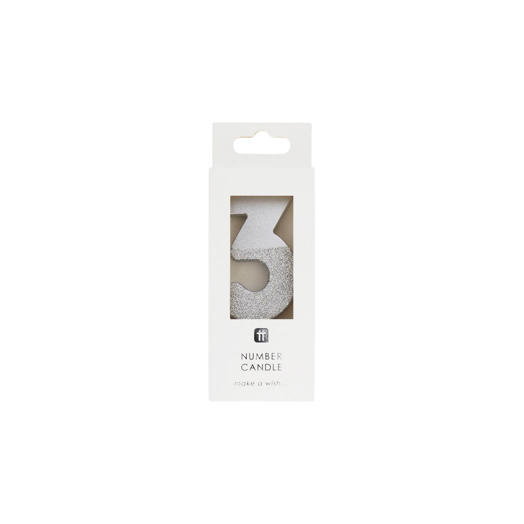 Silver number balloon shaped as the number three for birthday celebration from Parte Haus party supply store in Bethesda Maryland