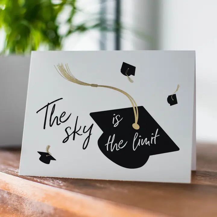 Black and gold graduation card with cap design for graduation celebration from Parte Haus party supply store in Bethesda MD