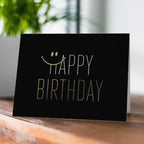 Black gold birthday greeting card with smiley face text for birthday theme from Parte Haus party supply store in Bethesda MD