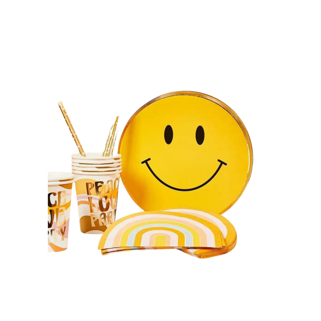 Yellow smiley paper plates with rainbow cups for birthday from Parte Haus party supply store in Bethesda Maryland