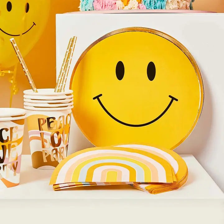 Gold smiley face paper plates with foiled edge cheerful birthday theme from Parte Haus party supply store in Bethesda MD