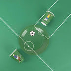 Green soccer themed paper cups and plate for sports birthday from Parte Haus party supply store in Bethesda Maryland