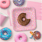 Pink sprinkles dinner paper plates with donuts and utensils birthday theme from Parte Haus party supply store in Bethesda Maryland