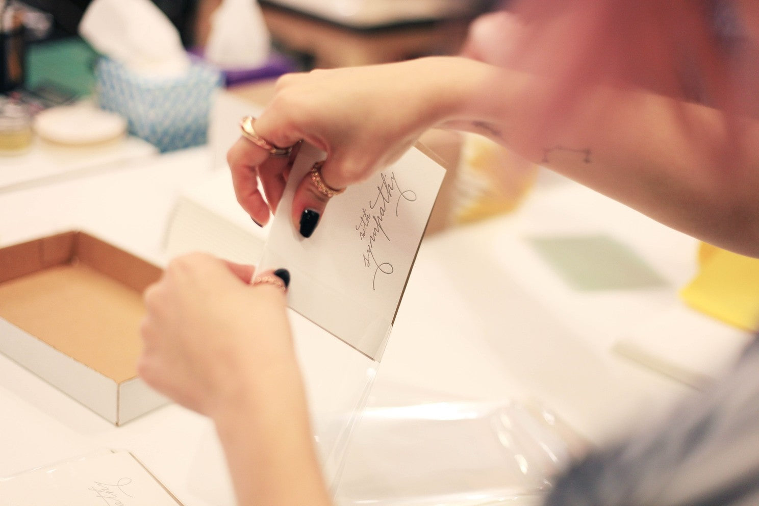 White sympathy card with handwritten script for loss from Parte Haus party supply store in Bethesda Maryland