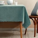 Blue tablecloth with scalloped edge on wooden table dining event from Parte Haus party supply store in Bethesda Maryland
