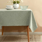 Gray tablecloth with scalloped edge on dining table spring decor from Parte Haus party supply store in Bethesda MD