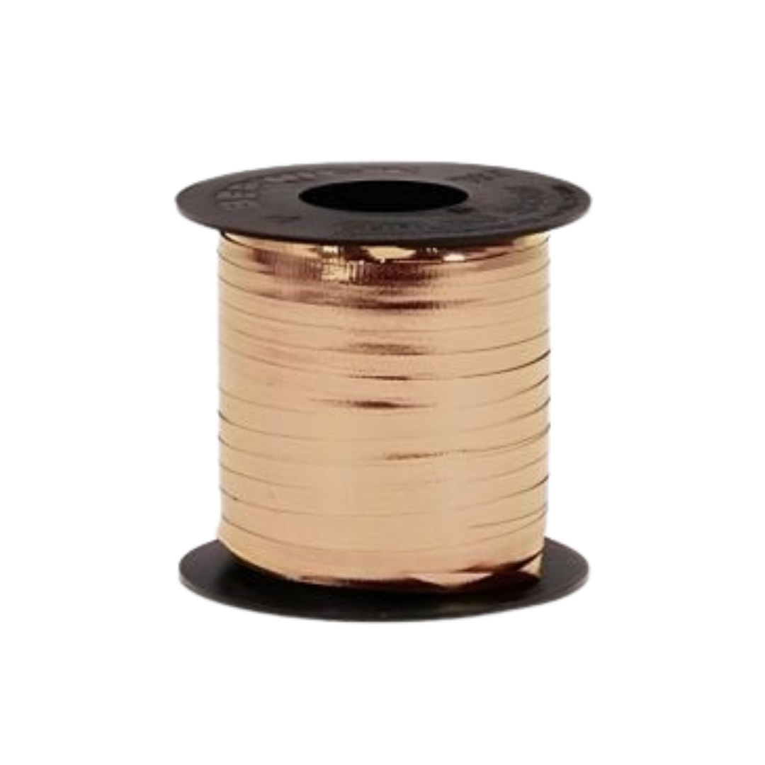 Gold curling ribbon spool for gift wrapping celebrations from Parte Haus party supply store in Bethesda MD