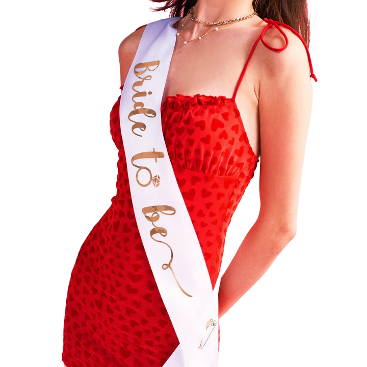 Red heart dress and white bride to be sash for bachelorette from Parte Haus party supply store in Bethesda Maryland