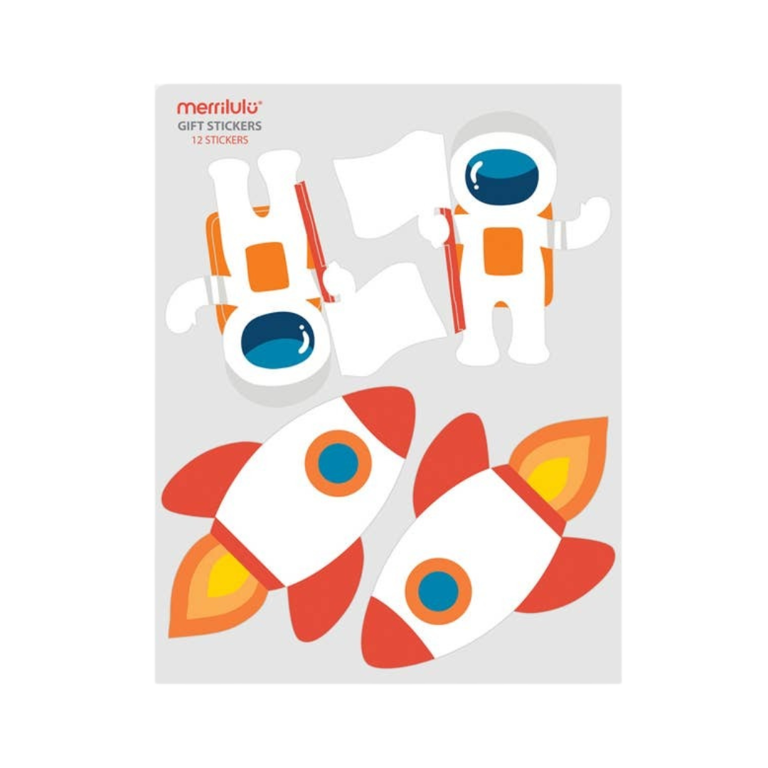 Orange and white astronaut and rocket ship gift stickers space theme from Parte Haus party supply store in Bethesda MD.