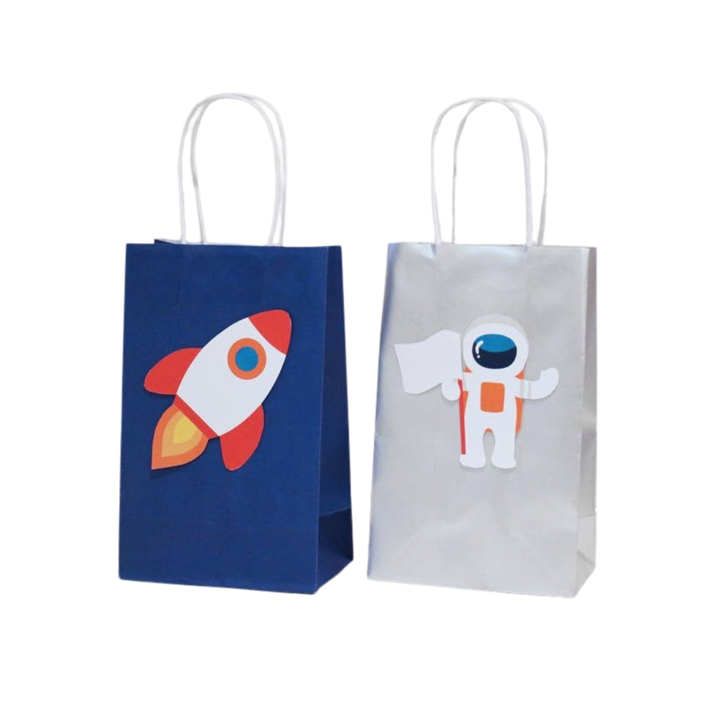 Blue rocket space gift bag and white astronaut gift bag for space birthday from Parte Haus party supply store in Bethesda MD.