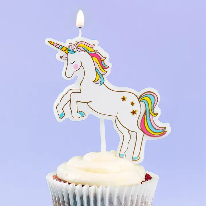 White unicorn candle with rainbow mane cake topper for birthday from Parte Haus party supply store in Bethesda MD