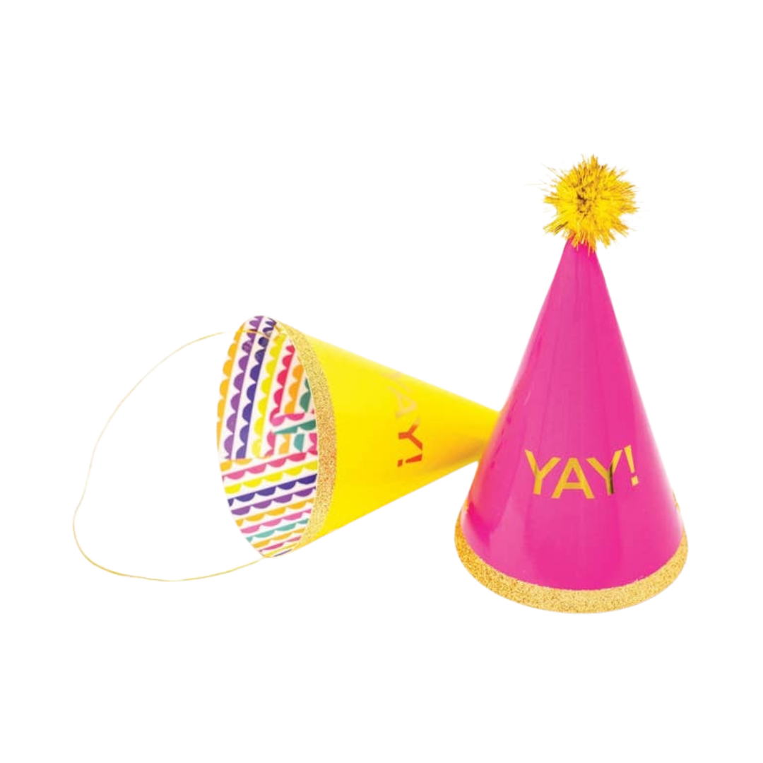 Pink and yellow party hats with gold pompom birthday celebration from Parte Haus party supply store in Bethesda MD