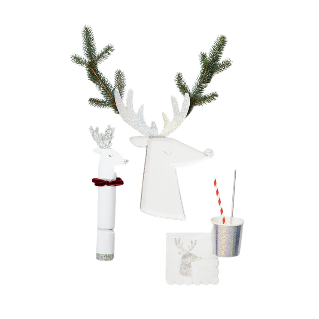 White reindeer Christmas decoration set with glitter and greenery from Parte Haus party supply store in Bethesda Maryland