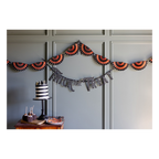 Black and orange Halloween paper fan garland and Trick or Treat banner from Parte Haus party supply store in Bethesda MD