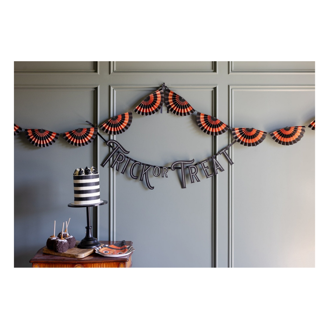 Black and orange Halloween paper fan garland and Trick or Treat banner from Parte Haus party supply store in Bethesda MD