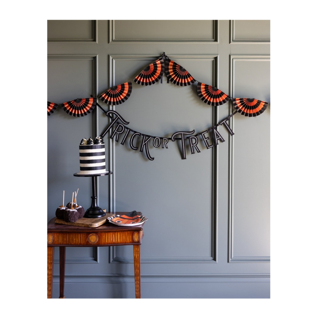 Orange and black Halloween garland with trick or treat banner spooky decor from Parte Haus party supply store in Bethesda Maryland