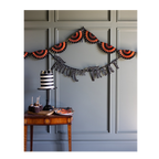 Orange and black Halloween garland with trick or treat banner spooky decor from Parte Haus party supply store in Bethesda Maryland
