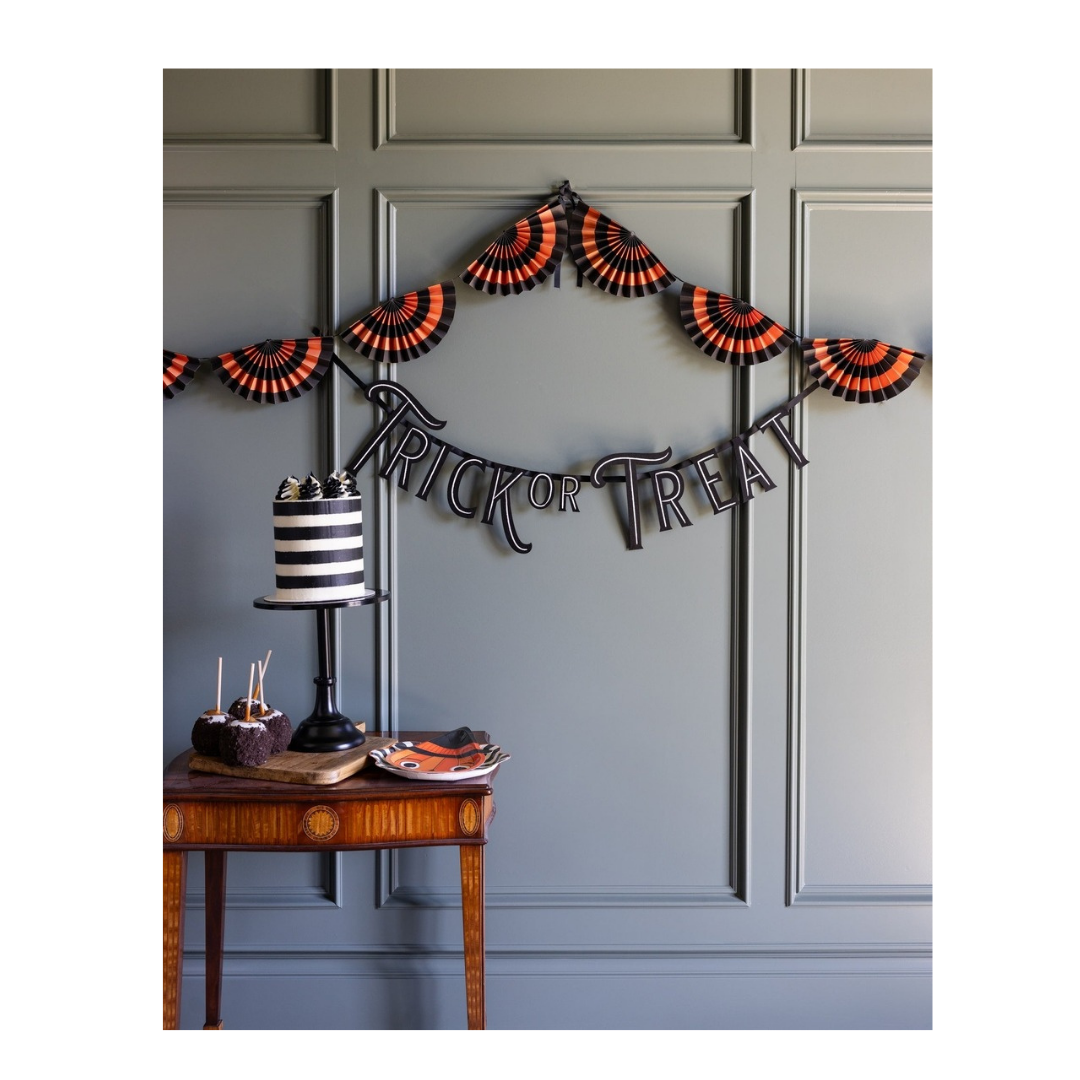 Orange and black Halloween garland with trick or treat banner spooky decor from Parte Haus party supply store in Bethesda Maryland