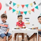 Colorful race car birthday banner with race flag and traffic light theme from Parte Haus party supply store in Bethesda MD