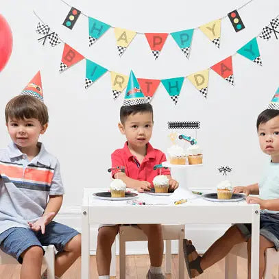 Colorful race car birthday banner with race flag and traffic light theme from Parte Haus party supply store in Bethesda MD