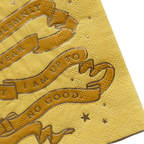Yellow napkin with metallic gold script banner stars Harry Potter themed from Parte Haus party supply store in Bethesda Maryland