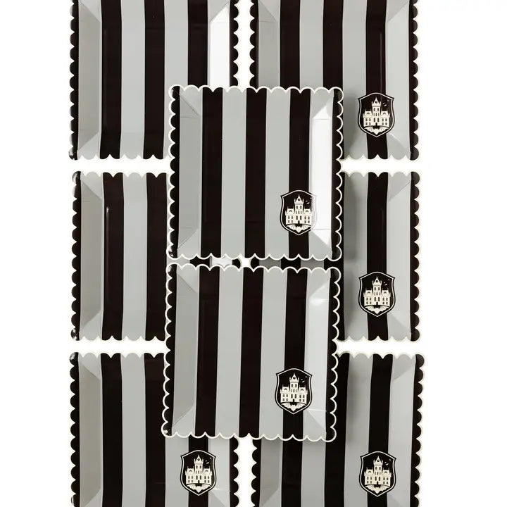 Black striped paper plates with scalloped edges and haunted house crest Halloween theme from Parte Haus party supply store in Bethesda MD