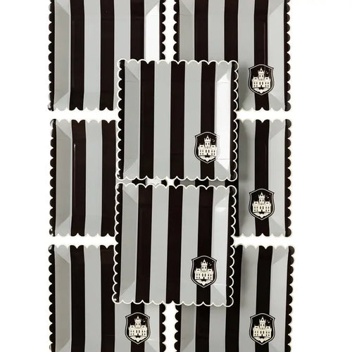 Black striped paper plates with scalloped edges and haunted house crest Halloween theme from Parte Haus party supply store in Bethesda MD
