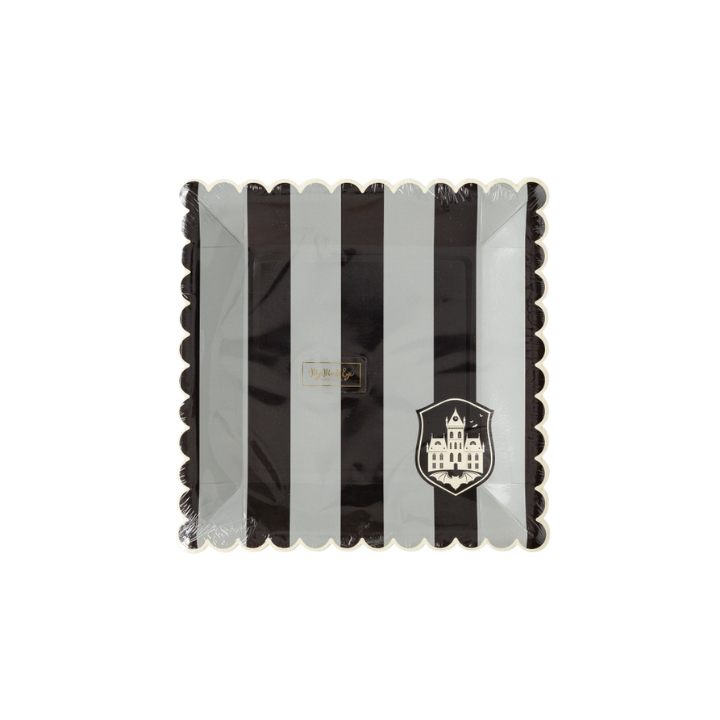 Black and white striped square paper plate with haunted house crest for Halloween from Parte Haus party supply store in Bethesda MD