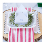 White and silver scalloped edge plate with mini house winter holiday decor from Parte Haus party supply store in Bethesda MD