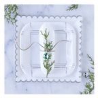 White square scalloped edge plate with plaid design for holiday table setting from Parte Haus party supply store in Bethesda MD.