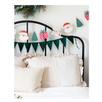 Green and red Christmas garland with Santa trees gifts and reindeer from Parte Haus party supply store in Bethesda MD
