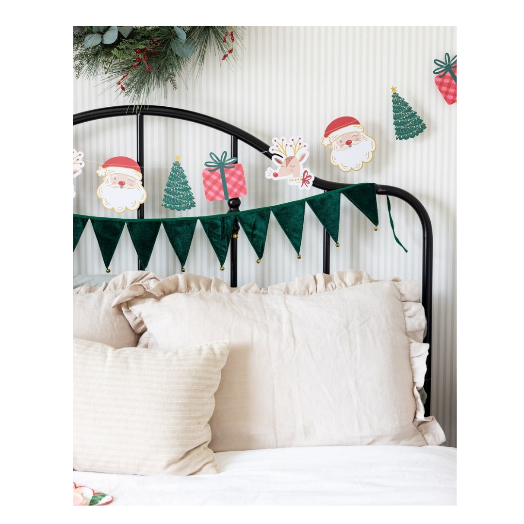 Green and red Christmas garland with Santa trees gifts and reindeer from Parte Haus party supply store in Bethesda MD