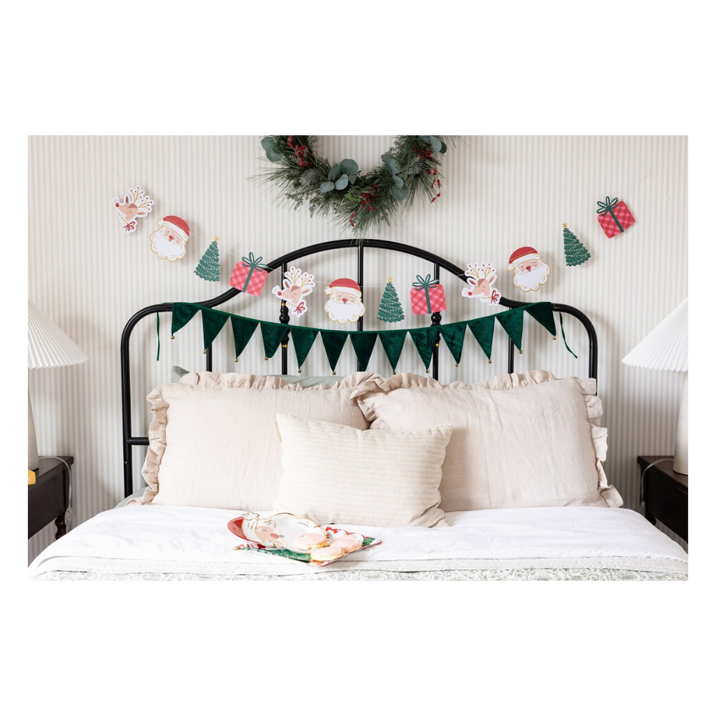 Green Christmas garland with Santa and tree designs bedroom holiday decor from Parte Haus party supply store in Bethesda MD