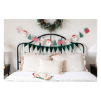 Green Christmas garland with Santa and tree designs bedroom holiday decor from Parte Haus party supply store in Bethesda MD