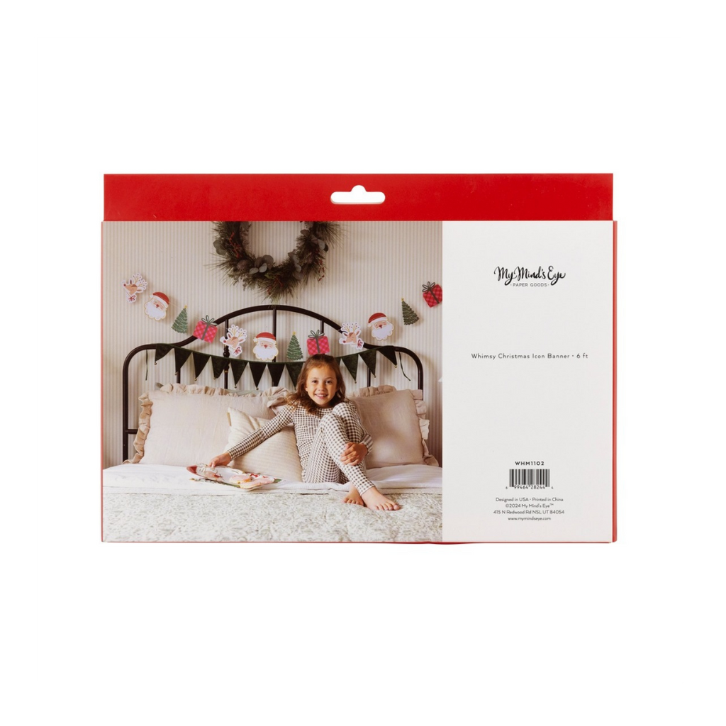 red Whimsy Christmas banner with Santa and tree icons holiday decor above bed from Parte Haus party supply store in Bethesda Maryland