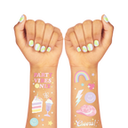 Pastel temporary tattoos colorful cute birthday theme on arms from Parte Haus party supply store in Bethesda Maryland