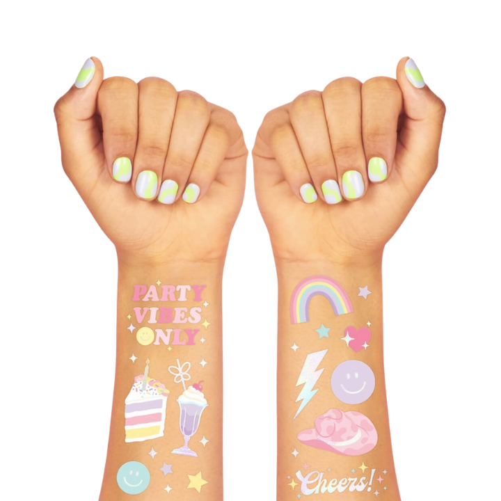 Pastel temporary tattoos colorful cute birthday theme on arms from Parte Haus party supply store in Bethesda Maryland