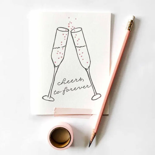 White wedding congratulations card with champagne flutes cheers to forever from Parte Haus party supply store in Bethesda MD