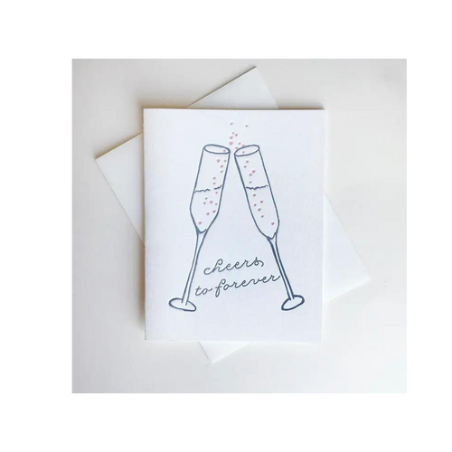 White wedding congratulations card with champagne glasses cheers illustration marriage from Parte Haus party supply store in Bethesda Maryland